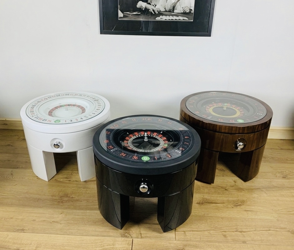 The three Simply Roulette finishes photographed together — White Lacquer, Black Piano, and Figured Walnut, each fitted with the chrome Puller